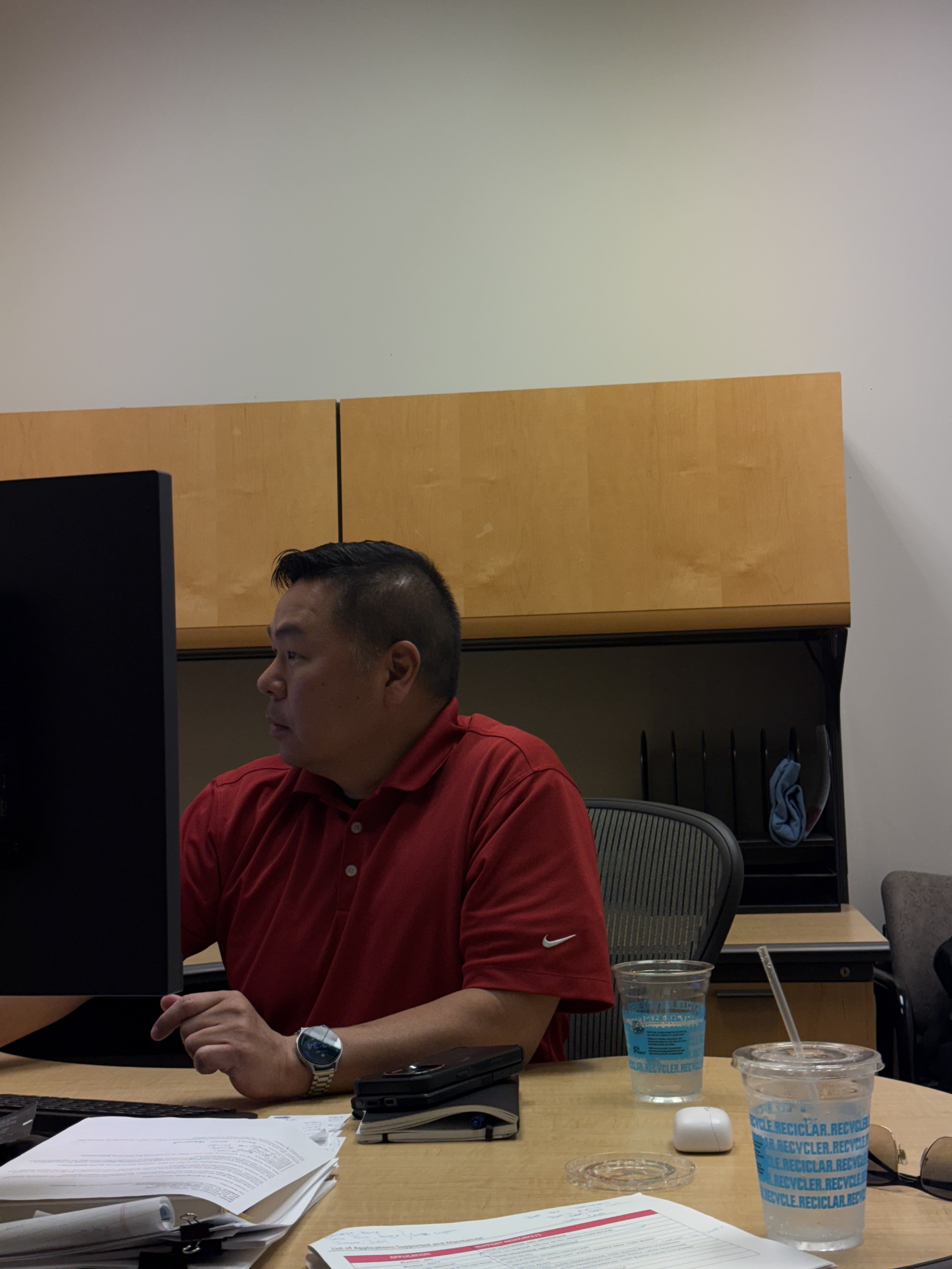 Joseph Park in profile while working at a monitor.